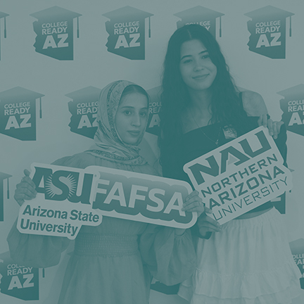 Two students holding ASU, FAFSA and NAU signage